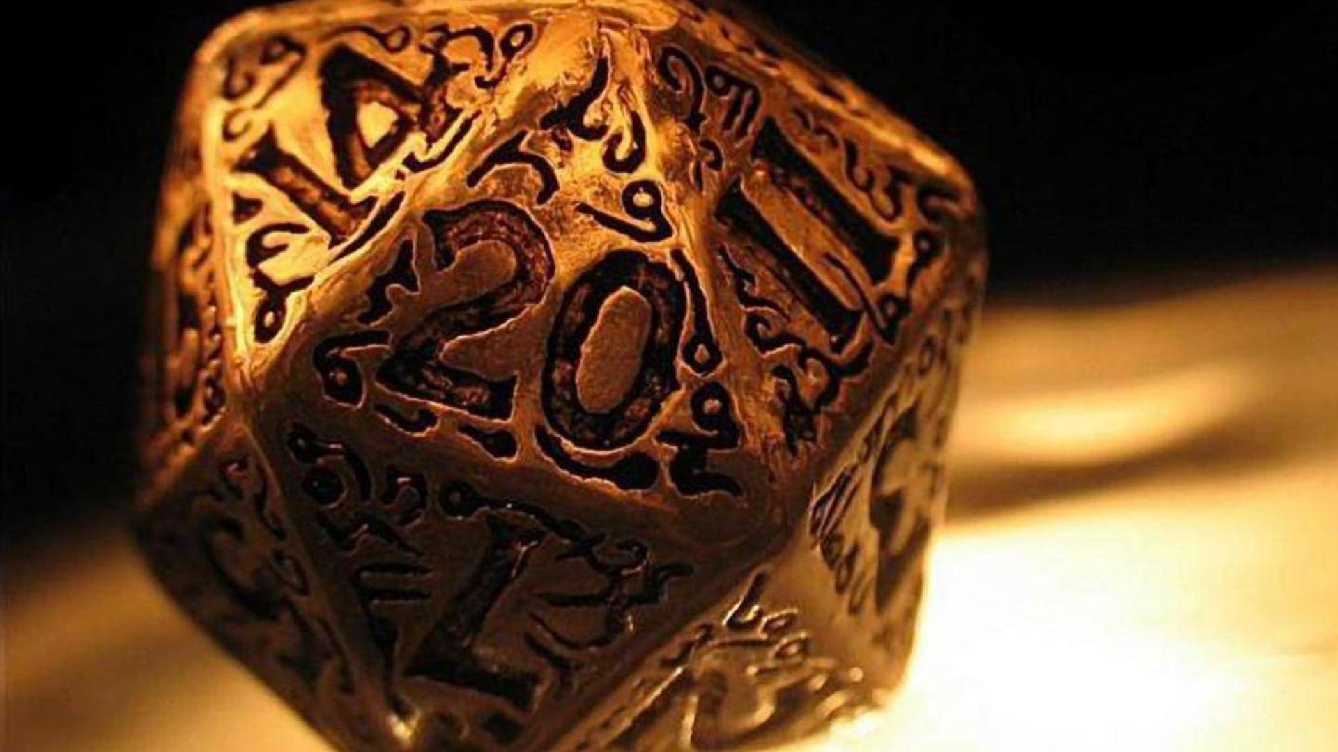 A bronze like metallic twenty sided die in the form of an convex regular icosahedron, showing a 20 on the side facing the viewer.