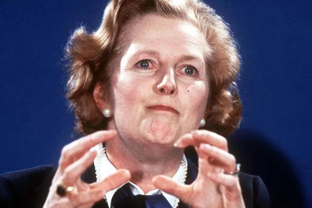 Thatcher pulling the strings... or grabbing buns or babies or something.  Scary ugly lady, with scary gesticulation.