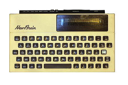 A Grundy New Brain computer, a beige microcomputer with a black keyboard and a tiny little 16-character display in the top-right.