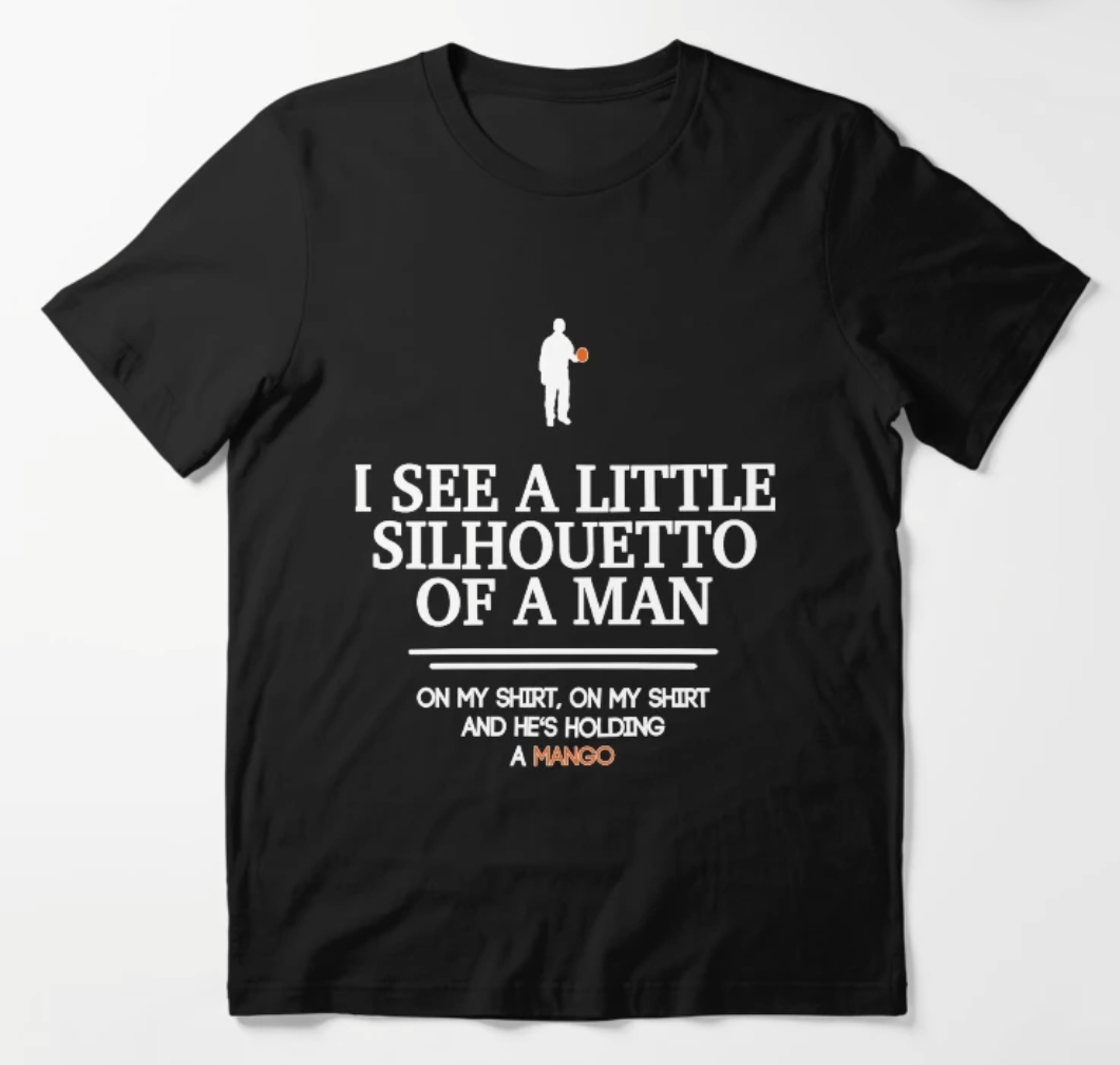 T-Shirt, black, with white text "I see a little silhouette-o of a man, on my shirt, on my shirt, and he's holding a mango", and a picture matching this description above. 