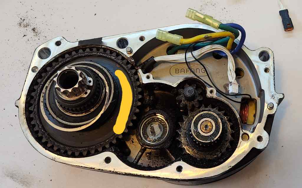 top down view of dismantled Bafang G510 motor, showing the three reduction axles and the motor axle. The secondary axle has been removed for clarity