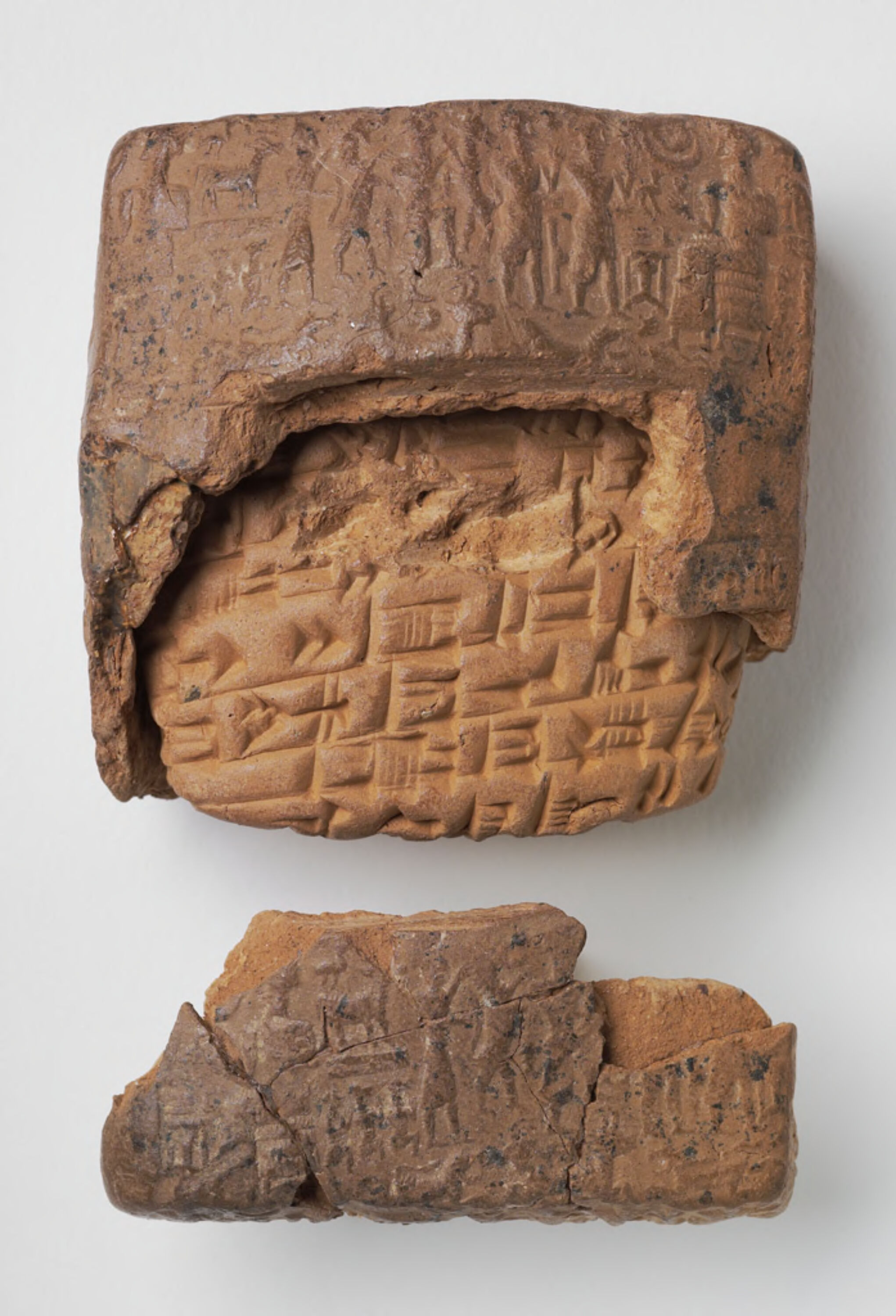 An Old Assyrian (circa 1800BCE) clay tablet partly encased in a clay envelope