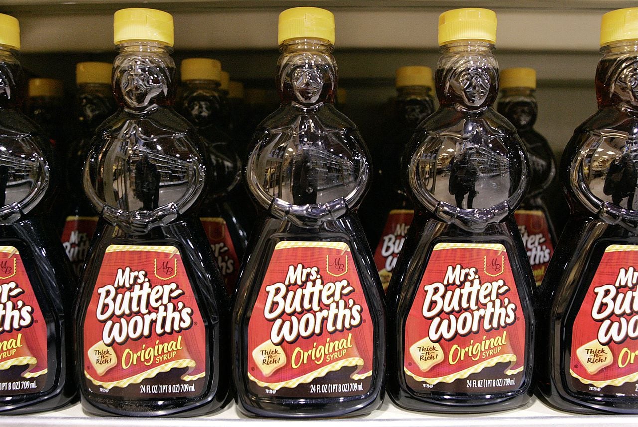 Picture of Mrs Butterworth shaped syrup bottles on a shelf
